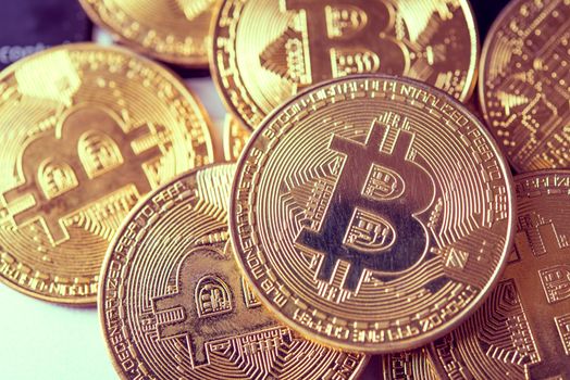 close-up bitcoin and its business-class laptop work and bring transactions across the network and help with today's business management,