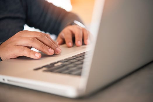 Business woman working on laptop computer in office