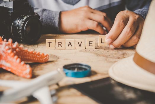 Tourism planning Accessories costumes. Passports, luggage, The cost of travel maps prepared for the trip and word for "Travel" on the map