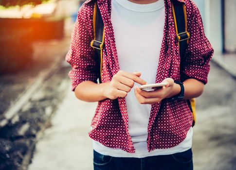 Traveler using smartphone for data connection and search to data