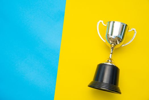 Top view for trophy placed on a colorful background.