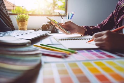 designer graphic creative ,creativity woman  working on laptop and designing  coloring colour ideas style