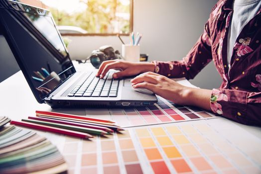 designer graphic creative ,creativity woman  working on laptop and designing  coloring colour ideas style