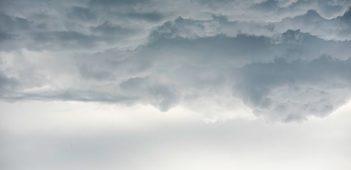 Rain clouds background.Clouds become dark gray like a big smoke before rainfall