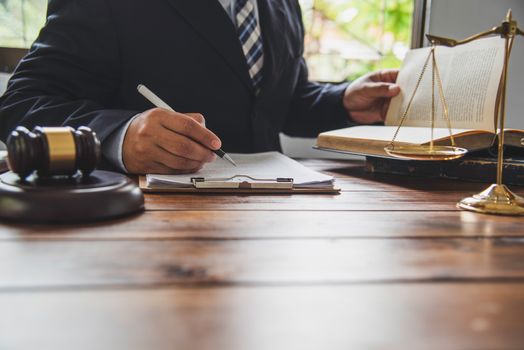 Law theme, mallet of the judge, law enforcement officers, evidence-based cases, and documents taken into account.