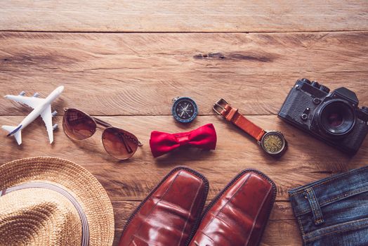 Travel Clothing accessories for men on wooden floor 