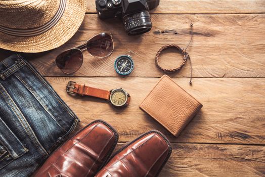 Travel Clothing accessories for men on wooden floor 