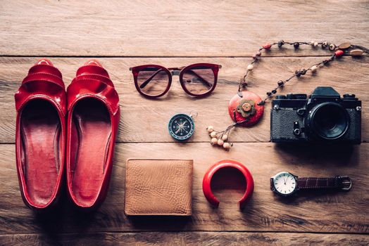 clothing for women, placed on a wooden floor.