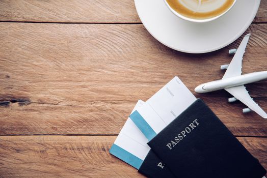 top view  passport and smartphone on wooden table, for travel concept