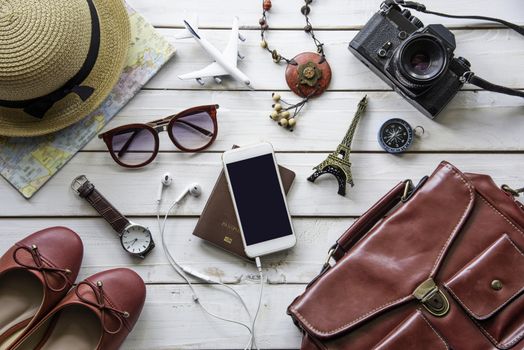 Travel accessories and costume on wooden floor