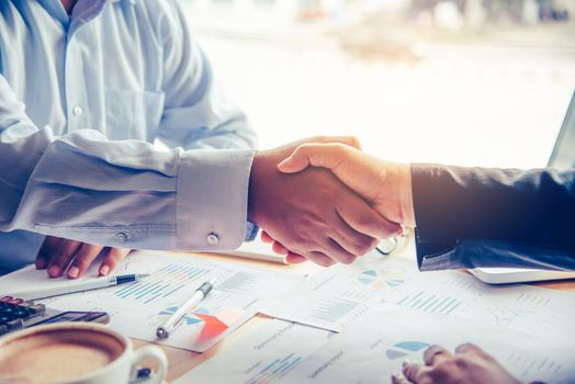 Handshake between joint venture businessmen after good management and have good concept 