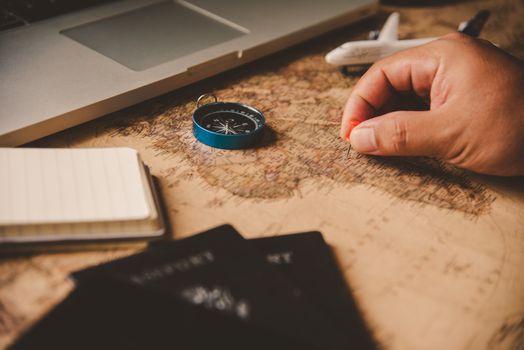 Travelers are planning a trip by searching the route on the map and searching for information on the internet.
