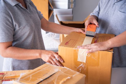 Team staff packed in brown boxes to deliver to customers 