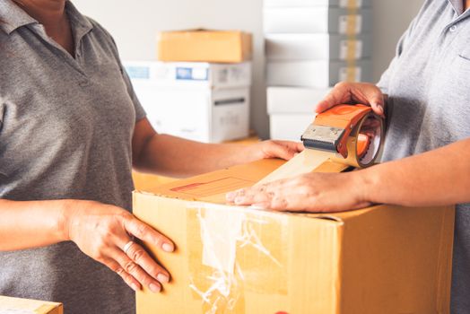 Team staff packed in brown boxes to deliver to customers 