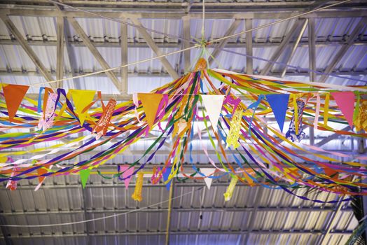 Colorful flags hanging in a beautiful line in the carnival.