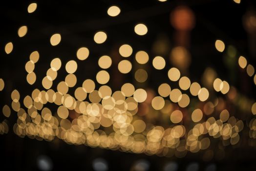 Colorful lights blur the background. Celebration at night.