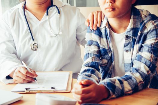 The doctor is discussing with the patient after a physical examination of the results and treatment guidelines.