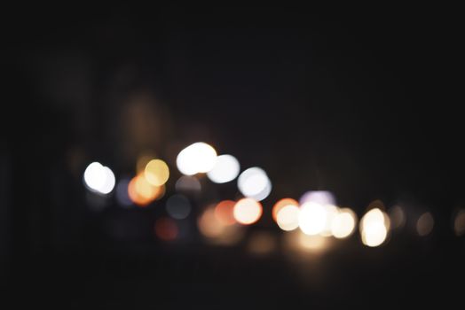 Colorful lights blur the background. Celebration at night.