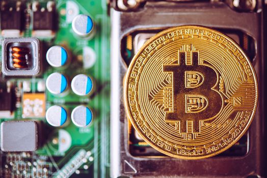 Bit coin placed on the electronics. Evolutionary concept in finance