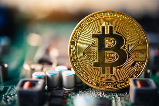 close-up bitcoin and its business-class laptop work and bring transactions across the network and help with today's business management,