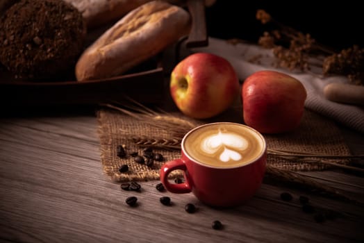Red coffee glass rests on wood floor. concept still life