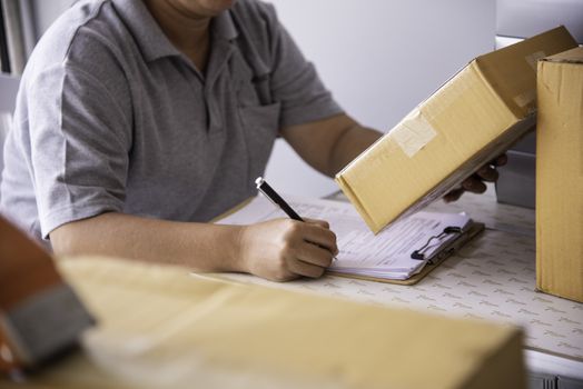 Shipping staff are checking the product before shipping to the customer.