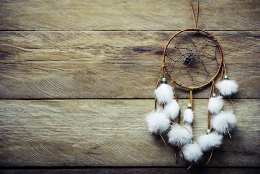 Dream catcher on wooden floor