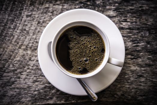 Top view of coffee mug on wooden floor