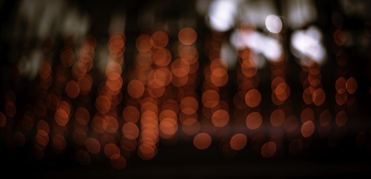 Colorful lights blur the background. Celebration at night.