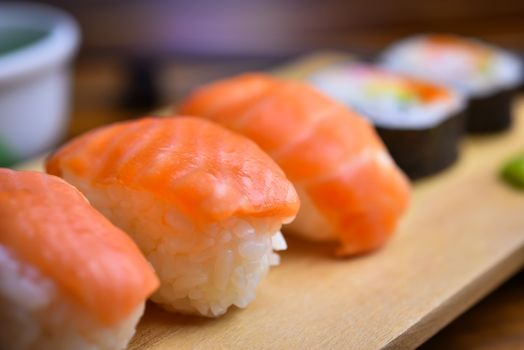 Salmon sushi on the wood plate