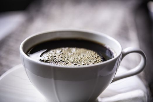 Coffee mug on wooden floor