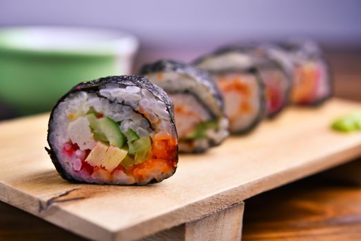 Sushi rolls on the wood plate
