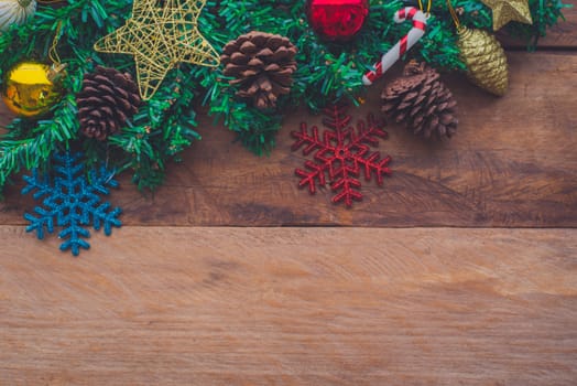 Christmas decorations are placed on a wooden floor.