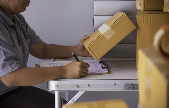 Shipping staff are checking the product before shipping to the customer.