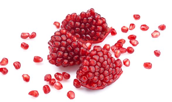 Ripe pomegranate seeds isolated on white with clipping path