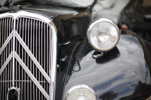 Close-up of headlights classic vintage car. Germany Exhibition