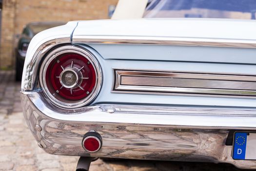 Classic vintage car. Close-up of headlights of luxurious vintage vehicle