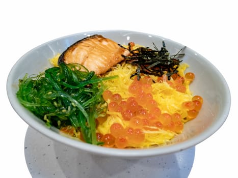 Salmon and roe on rice. Culture, tradition. Sasimi food in the bowl white isolated, Sashimi of fresh raw Salmon and roe on rice of Japanese tradition food restaurant