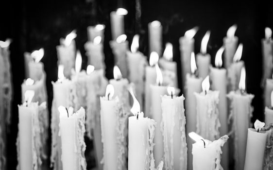 Wax candles to pray, detail of a religious tradition, belief and faith