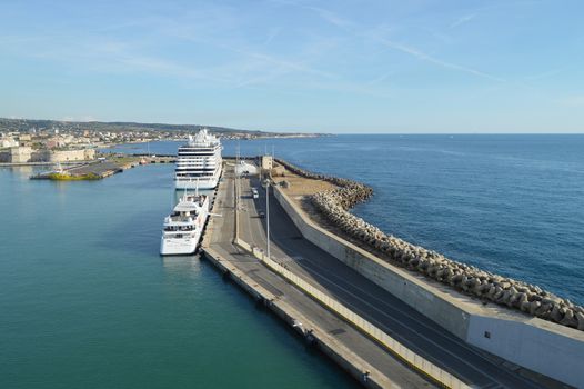 View of stone and concrete breakwaters along the pier, cruise liners and a panorama of the port of Civitavecchia, October 7, 2018.