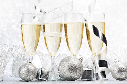 Champagne and decor on silver bokeh background