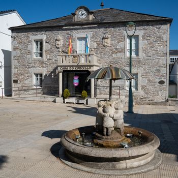Historic townhall of Castroverde with children water well, Camino de Santiago trail, Calicia, Spain
