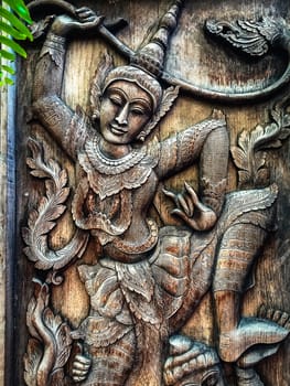 Closeup Wood carving Thai People in Literature