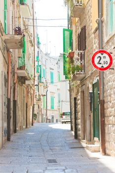 Molfetta, Apulia, Italy - Walking through an old alleyway in Molfetta