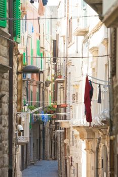 Molfetta, Apulia, Italy - Narrowness lifestyle in the old alleyways of Molfetta