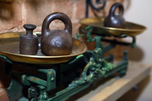 Very old iron weight scale with brass bowls and weights