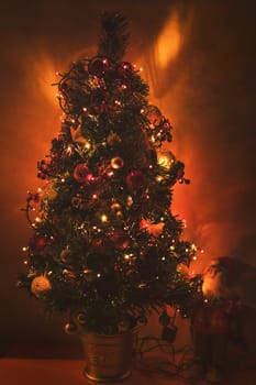 Feast of the Nativity. Beautiful decorated Christmas tree in living room.