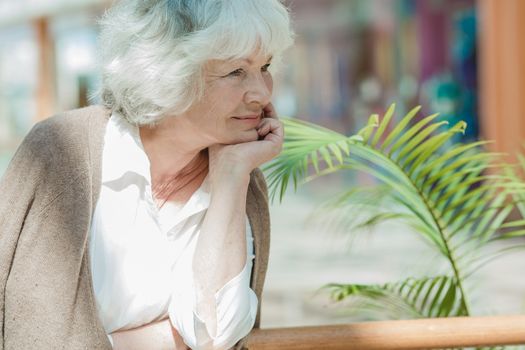 Portrait of nice smilig thoughtful senior woman close up