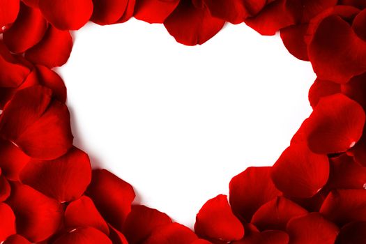 Heart shape frame made of rose petals, white isolated copy space