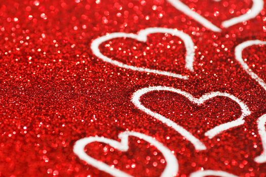 Red glitter background with hearts, valentines day design